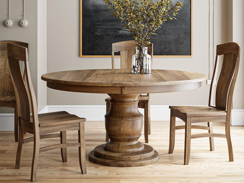 Augusta pedestal dining table and side chairs in a room setting.