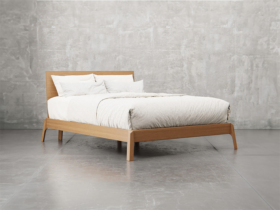 Bellevue bed frame angle view in sealy stain.