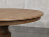 Augusta pedestal dining table zoomed view in almond stain.