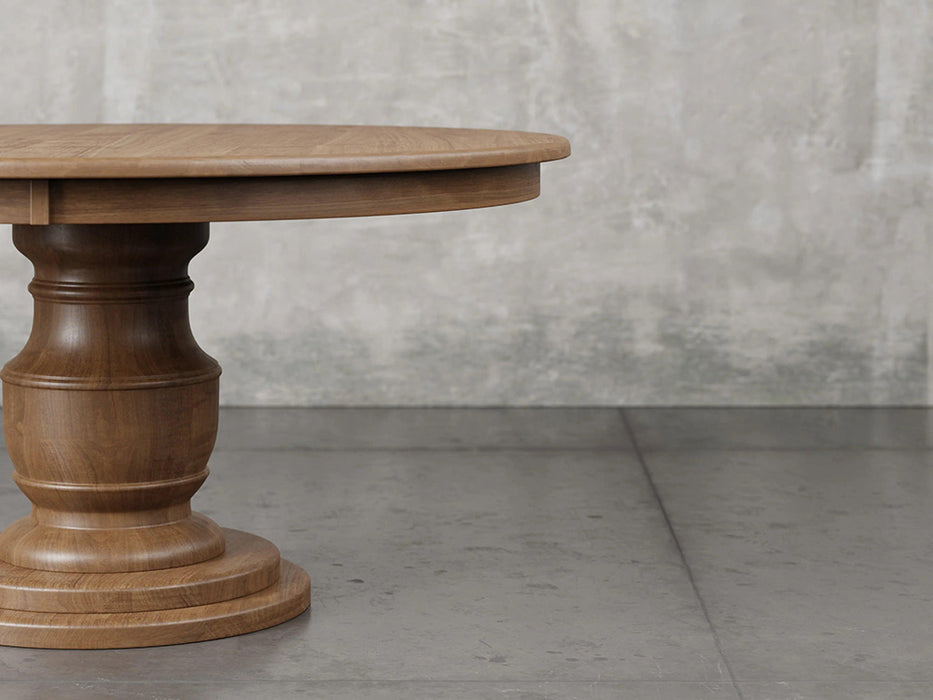 Augusta pedestal dining table close up front view in almond stain.