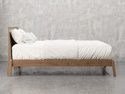 Bellevue bed frame side view in almond stain.