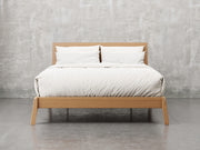 Bellevue bed frame front view in sealy stain.