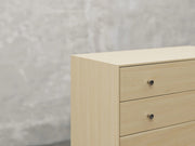 Bellevue chest close up view in natural brown maple finish.