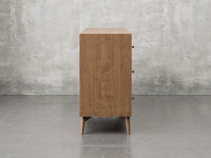 Bellevue chest side view in almond stain.