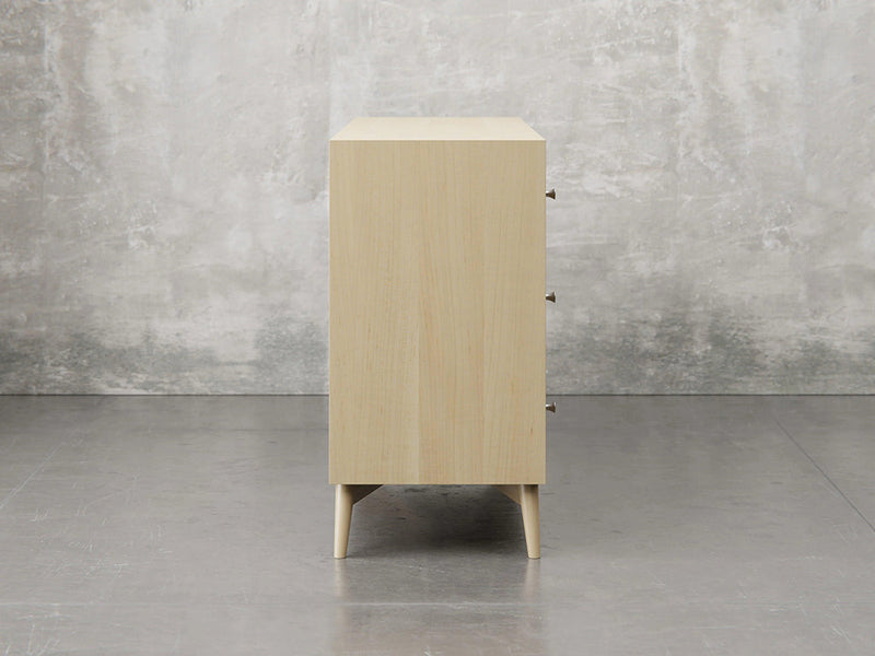 Bellevue dresser side view in natural brown maple finish.