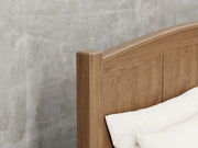 Fullerton bed frame close up view in almond stain.