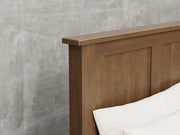 Lansing bed close up view in cappuccino stain.