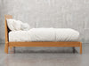 Nashville bed side view in natural cherry finish.