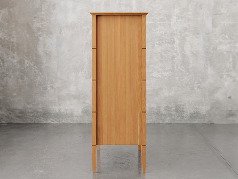 Nashville chest side view in natural cherry finish.