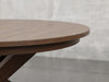 Pittsburgh round dining table close up view in cappuccino stain.