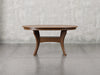 Providence dining table front view in earthtone stain.