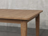 Raleigh shaker leg dining table angle view in almond stain.