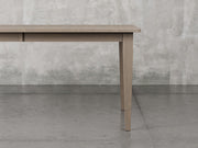 Raleigh shaker leg dining table close up view in driftwood stain.