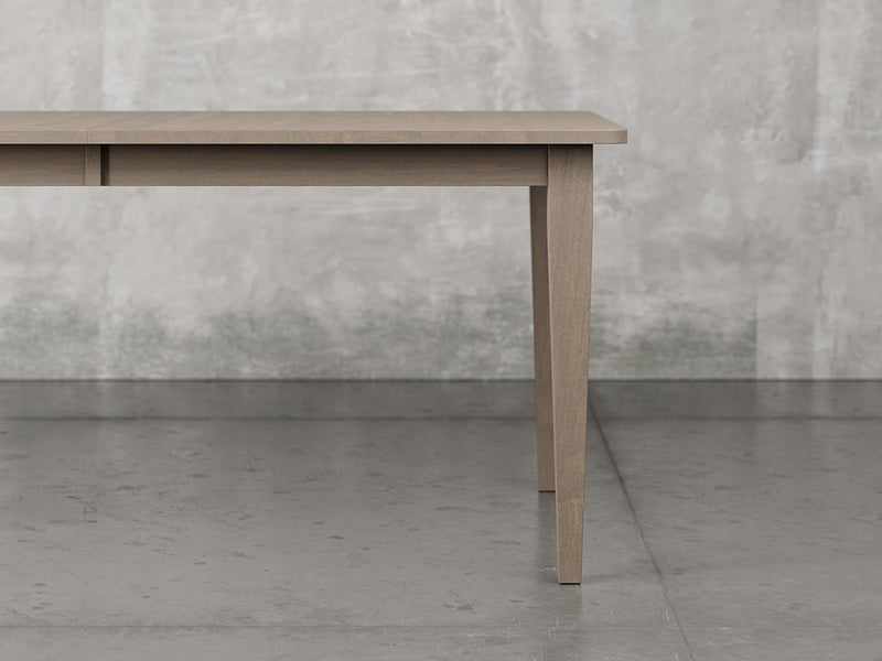 Raleigh shaker leg dining table close up view in driftwood stain.