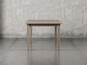 Raleigh shaker leg dining table side view in driftwood stain.