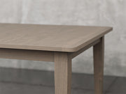 Raleigh shaker leg dining table angle view in driftwood stain.