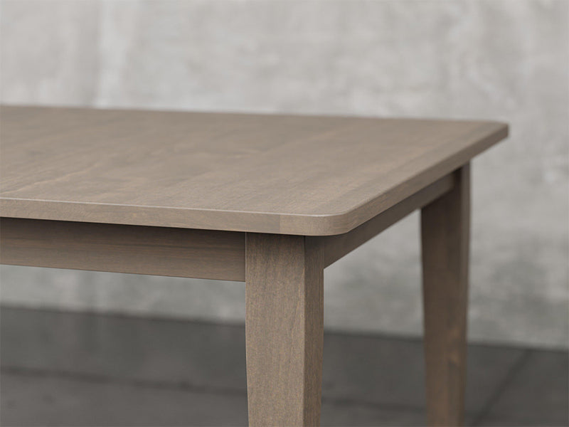 Raleigh shaker leg dining table angle view in driftwood stain.