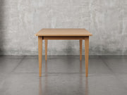 Raleigh shaker leg dining table side view in sealy stain.