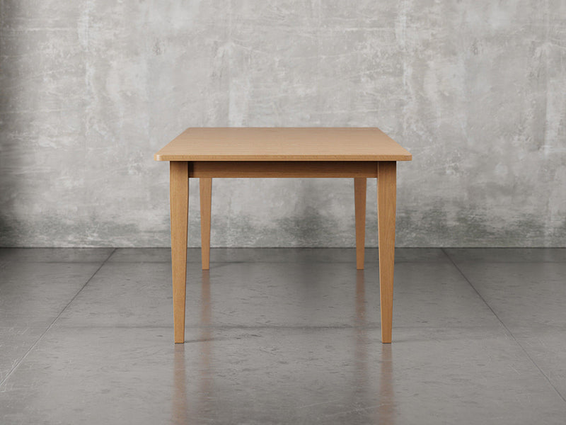 Raleigh shaker leg dining table side view in sealy stain.