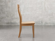 Raleigh side chair side view in sealy stain.